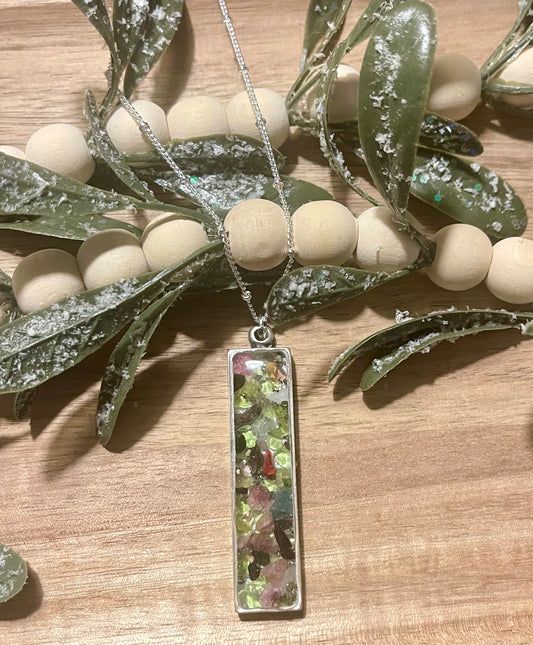 Peridot and garnet pendant with a mustard seed